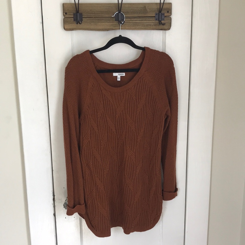 Burnt Orange crew-neck sweater with side detail.